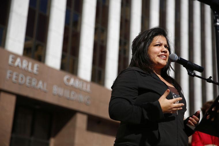 Abortion survivor Angela Martinez Balderaz shares her story with the thousands gathered for the Rally for Life outside the Earle Cabell Federal Courthouse, site of the landmark Roe v Wade lawsuit filing over 40 years ago, in downtown Dallas, Saturday, Jan. 19, 2013. The anti-abortion rally marks the 40th anniversary of Roe v. Wade, the Supreme Court decision that legalized abortion. Between 8,000-10,000 anti-abortion supporters gathered for the March for Life from the Cathedral Guadalupe to the Earle Cabell Federal Courthouse. (AP Photo/The Dallas Morning News, Tom Fox)
 