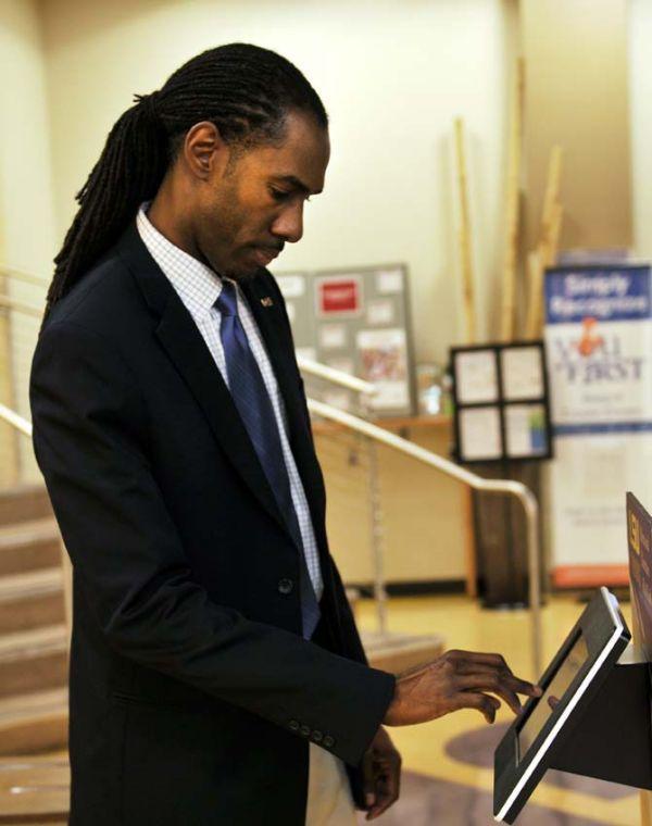 Dean Samuels, LSU's Dining and Marketing Director, demonstrates Friday, Jan. 11, how to use LSU's new dining app on an iPad kiosk in The 5. The app, which is exclusively available for Apple products, features a variety of options, including menus from LSU's dining halls, nutritional information, and an interactive map function. The app will be released as an update for the myLSU app but is also available for separate download from Apple's app store.
 