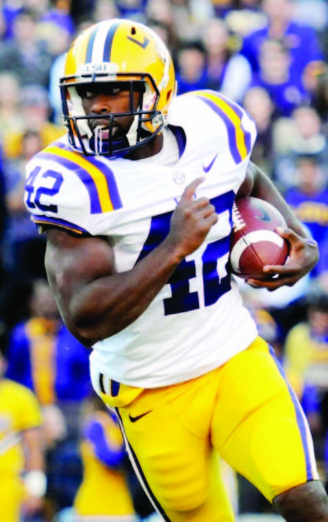 LSU junior running back Michael Ford (42) runs for positive yardage during the Tigers' 41-35 victory over Ole Miss Saturday Nov. 17, 2012 in Tiger Stadium.
 