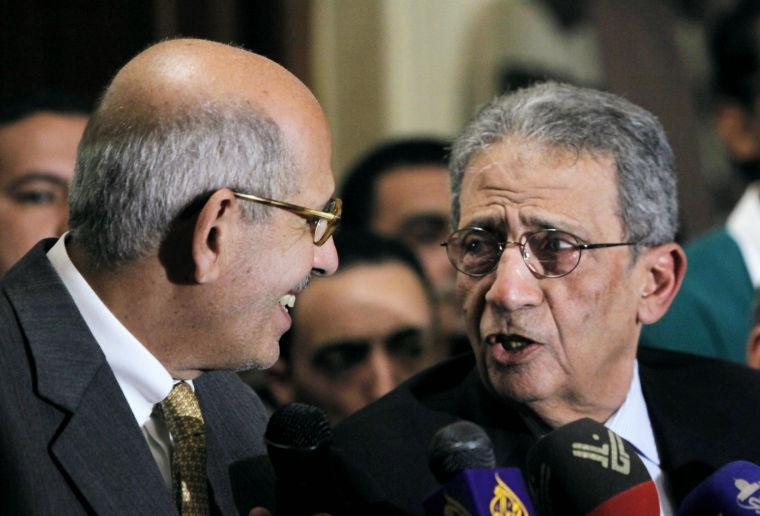 Mohamed El Baradei, left, Nobel peace laureate and former director of the U.N.'s nuclear agency, speaks with former Egyptian Foreign Minister and presidential candidate Amr Moussa during a news conference following the meeting of the National Salvation Front in Cairo, Monday, Jan. 28, 2013. The group, Egypt&#8217;s main opposition coalition, has rejected President Mohammed Morsi's call for dialogue to resolve the country&#8217;s political crisis, demanding that he first make deep concessions to break what they call the monopoly that Islamists have tried to impose on power. (AP Photo/Amr Nabil)
 