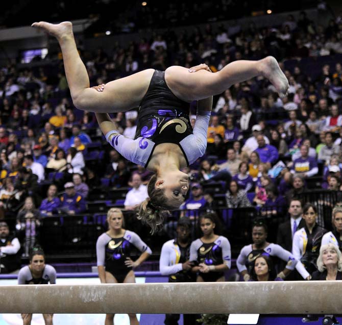 LSU sophomore all-around Jessie Jordan tumbles over a balance beam Jan. 4, 2013 during the Tiger's 196-194 win over NC State in the PMAC.
 