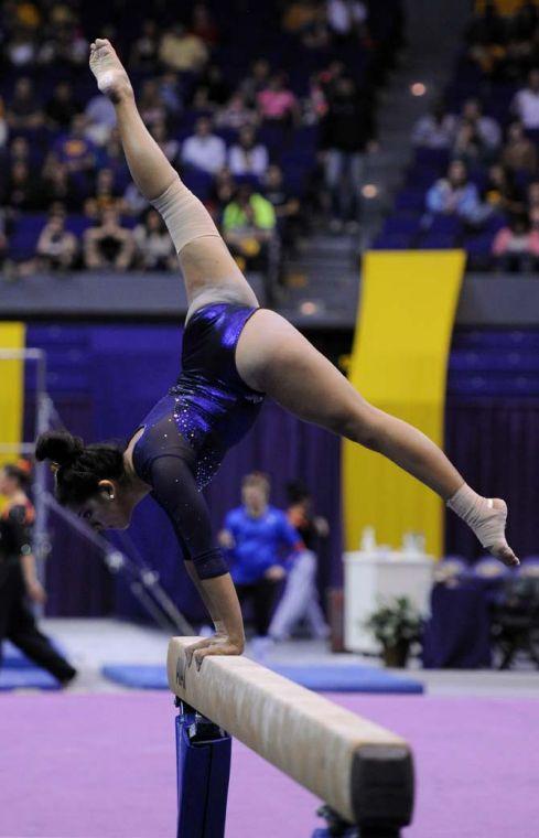 LSU senior all-around Erica Garcia balances on her hands on the beam Friday, Jan. 11, 2013 during the Tiger's 196.875-196.575 win over Florida in the PMAC.
 