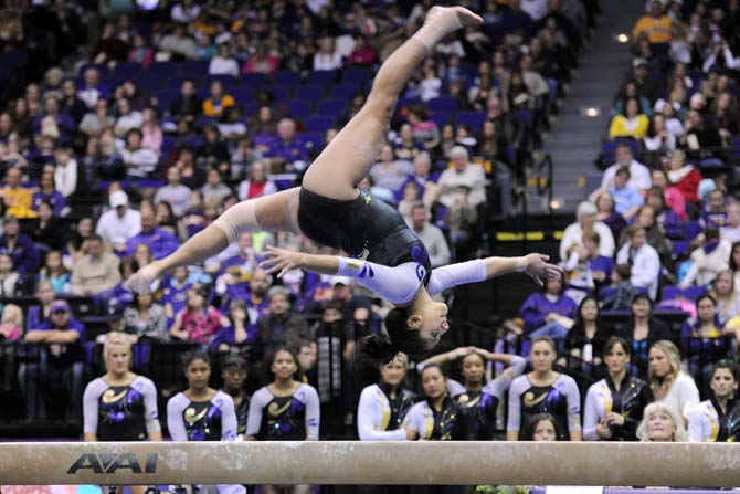 LSU senior all-around Ericka Garcia backflips on a balance beam Jan. 4, 2013 during the Tiger's 196-194 win over NC State in the PMAC.
 