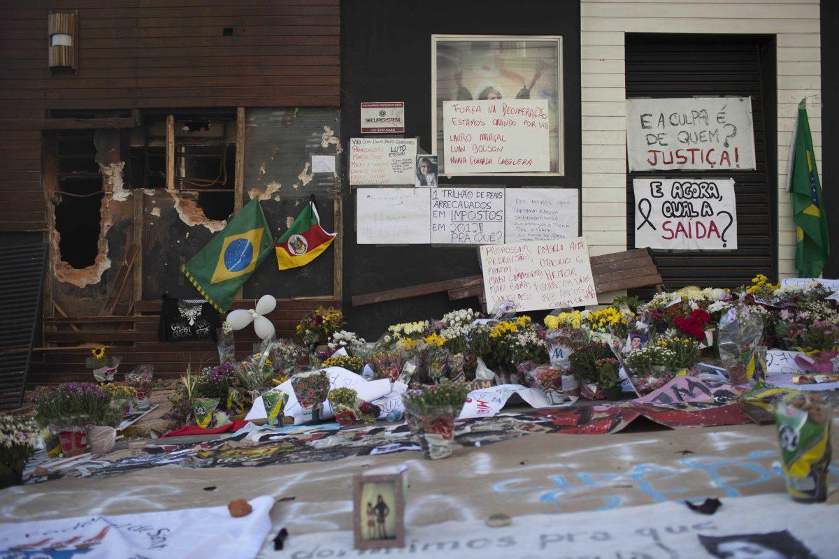 Posters, flowers, balloons and flags make up part of a makeshift memorial outside the Kiss nightclub in Santa Maria, Brazil, Wednesday, Jan. 30, 2013. A fast-moving fire roared through the crowded, windowless nightclub in this southern Brazilian city early Sunday, killing more than 230 people. Most of the dead were college students 18 to 21 years old, but they also included some minors. Almost all died from smoke inhalation rather than burns. The blaze was the deadliest in Brazil since at least 1961, when a fire that swept through a circus killed 503 people in Niteroi, Rio de Janeiro. (AP Photo/Felipe Dana)