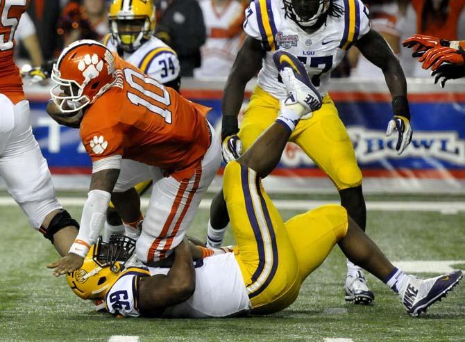 LSU junior defensive end Sam Montgomery (99) sacks Clemson quarterback Tajh Boyd (10) Monday, Dec. 31, 2012 during the Chick-fil-A Bowl against Clemson in Atlanta, Ga.
 