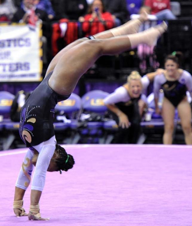 LSU sophomore all-around Llominica Hall flips during her floor routine Jan. 4, 2013 in the Tiger's 196-194 win over NC State in the PMAC.
 