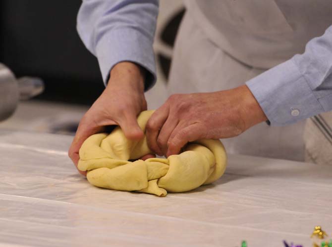 Felix Sherman Jr., the owner of Ambrosia Bakery, does a demonstration on how to make their delicious king cakes at the LSU Museum of Art on January 17, 2012.
 