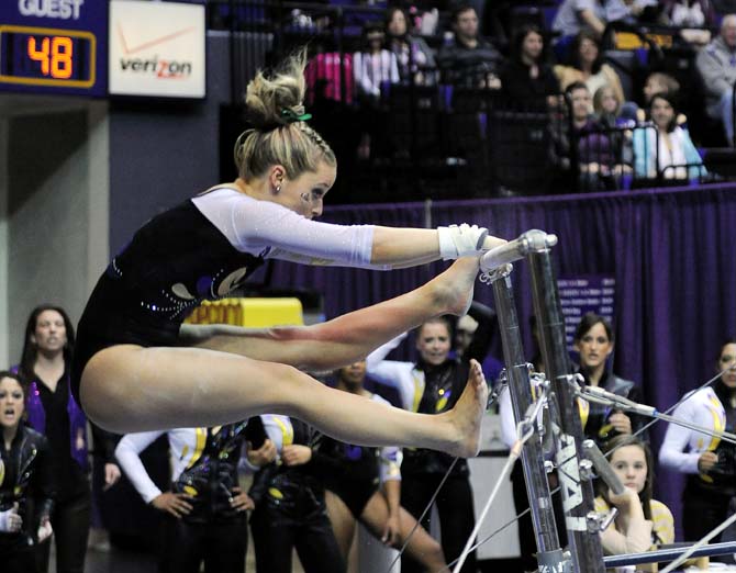 LSU sophomore all-around Jessie Jordan flips over uneven bars Jan. 4, 2013 during the Tiger's 196-194 win over NC State in the PMAC.
 