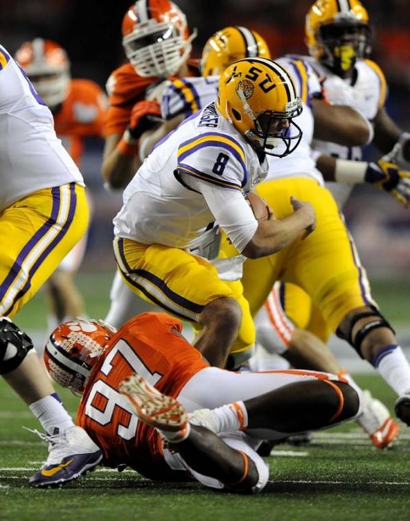 LSU junior quarterback Zach Mettenberger (8) is sacked by Clemson defensive end Malliciah Goodman Monday, Dec. 31, 2012 during the Tigers' 24-25 loss in the Chick-fil-A Bowl against Clemson in Atlanta, Ga.
 