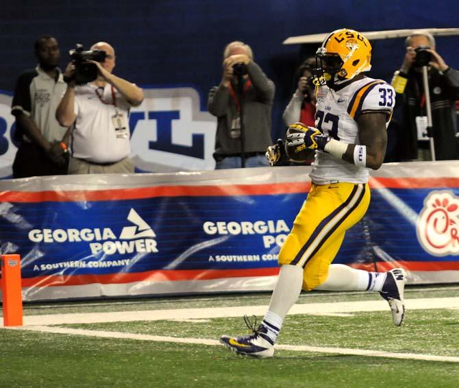 LSU freshman running back Jeremy Hill (33) waltzes into the endzone Dec. 31, 2012 during the first quarter of the Chick-fil-A Bowl game against Clemson in Atlanta, Ga.
 