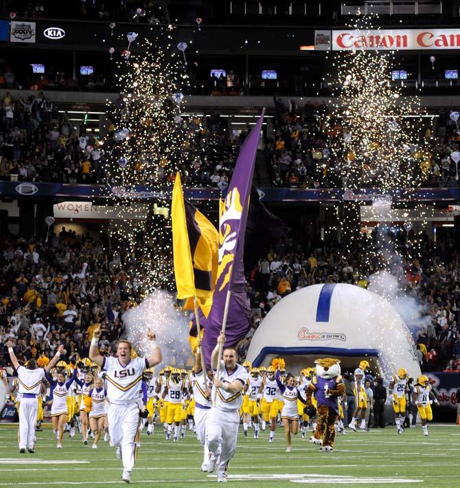 The LSU football team runs out of the tunnel Dec. 31, 2012 before LSU's 24-25 loss to Clemson in the Chick-fil-A Bowl in Atlanta, Ga.
 