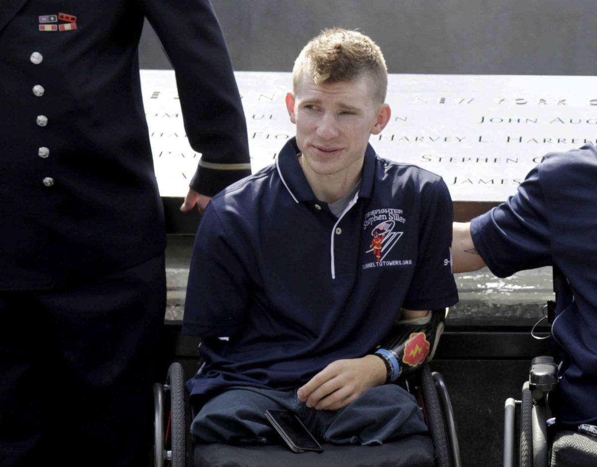 FILE - In this July 4, 2012 file photo, Army Sgt. Brendan Marrocco of Staten Island, N.Y., wearing a prosthetic arm, poses for a picture at the 9/11 Memorial in New York. Marrocco, 26, the first soldier to survive losing all four limbs in the Iraq war, has received a double-arm transplant in Baltimore. His father, Alex Marrocco, said Monday, Jan. 28, 2013 that his son had the operation on Dec. 18, 2012 at Johns Hopkins Hospital. (AP Photo/Seth Wenig, File)