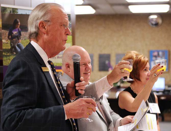 LSU School of Veterinary Medicine Dean Peter Haynes, Louisiana Commissioner of Agriculture and Forestry Michael Strain and WAFB anchor Diane Deaton toast to the success of the school on Jan. 12, 2013.
 