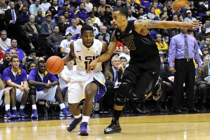 LSU junior guard Andre Stringer (10) moves around Missouri senior forward Laurence Bowers (21) during the Tigers' 73-70 victory against Mizzou Wednesday Jan. 30, 2013 in the PMAC.
 