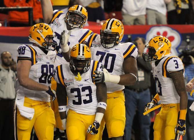 LSU freshman running back Jeremy Hill (33) celebrates with his teammates Dec. 31, 2012 after scoring a touchdown in the Chick-fil-A Bowl in Atlanta, Ga.
 