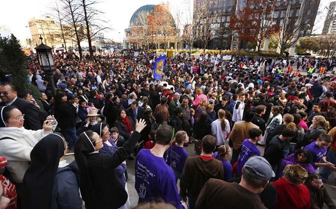 Thousands of anti-abortion supporters gathered on Ross Ave. in downtown Dallas, Saturday, Jan. 19, 2013 for the March for Life following a service at the Cathedral Guadalupe. The anti-abortion rally marks the 40th anniversary of Roe v. Wade, the Supreme Court decision that legalized abortion. Between 8,000-10,000 anti-abortion supporters gathered for the March for Life from the Cathedral Guadalupe to the Earle Cabell Federal Courthouse, site of the landmark Roe v Wade lawsuit filing over 40 years ago in Dallas. (AP Photo/The Dallas Morning News, Tom Fox)
 