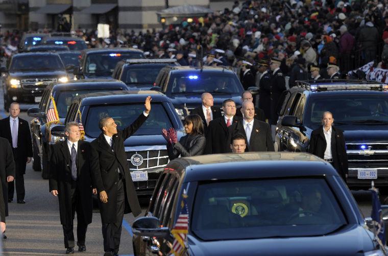 President Barck Obama and first lady Michelle Obama walk down Pennsylvania Avenue in the Inaugural Parade after the ceremonial swearing-in for the 57th Presidential Inauguration on Capitol Hill in Washington, Monday, Jan. 21, 2013. (AP Photo/Susan Walsh)
 