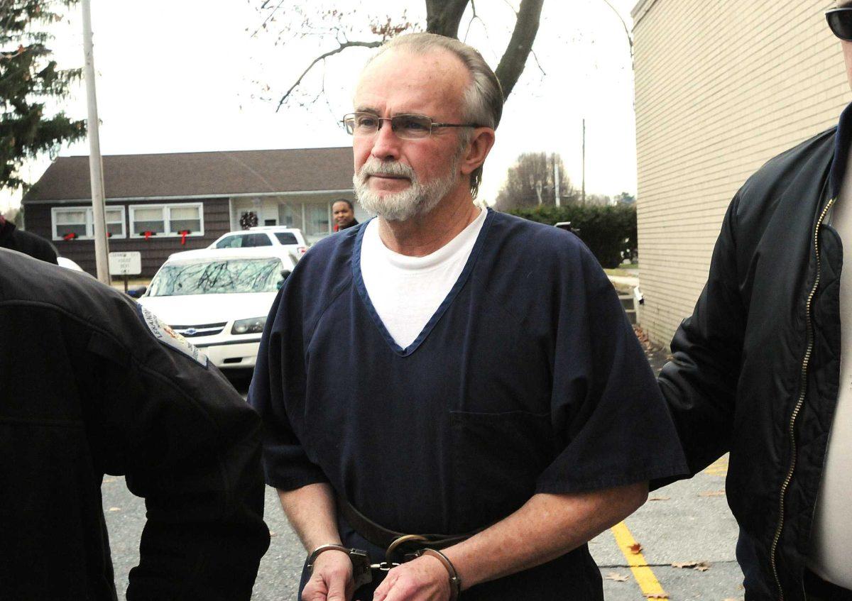 FILE -- In a Dec. 11, 2012, file photo, retired Pennsylvania pastor Arthur Schirmer is lead away from the Lebanon County Courthouse after a preliminary hearing in Lebanon, Pa. Schirmer is charged with killing both of his wives and is on trial in the death of his second wife. &#160; (AP Photo/Lebanon Daily News, Earl Brightbill) THE PATRIOT-NEWS OUT