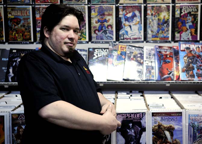 Shop manager James Gaspard stands in front of shelves of comic books in Louisiana's Double Play, Baton Rouge's only comic book store, Tuesday, Jan. 19, 2013. The shop is located on S. Sherwood Forest Blvd.
 