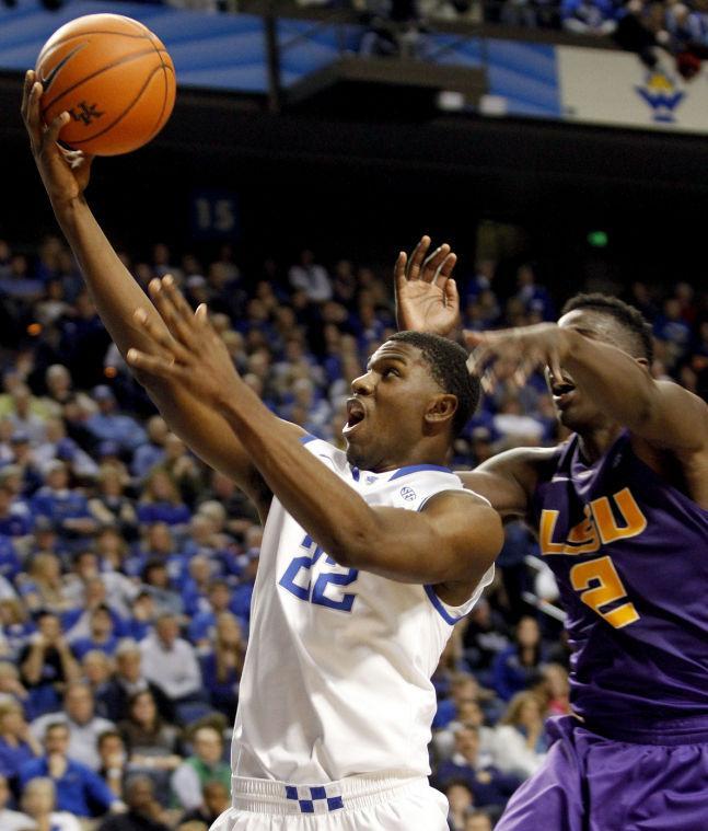 Kentucky's Alex Poythress (22) shoots under pressure from LSU's Johnny O'Bryant III, right, during the second half of an NCAA college basketball game at Rupp Arena in Lexington, Ky., Saturday, Jan. 26, 2013. Kentucky won 75-70. (AP Photo/James Crisp)
 