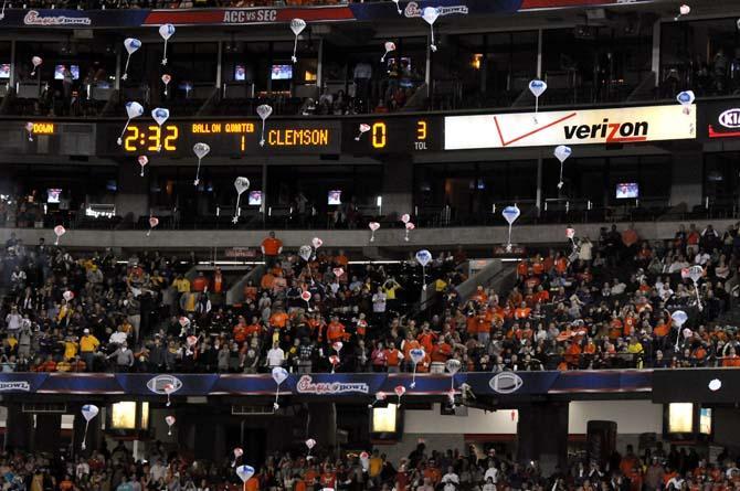 Chick-fil-A cows parachute to fans Dec. 31, 2012 before the Chick-fil-A Bowl in Atlanta, Ga.
 