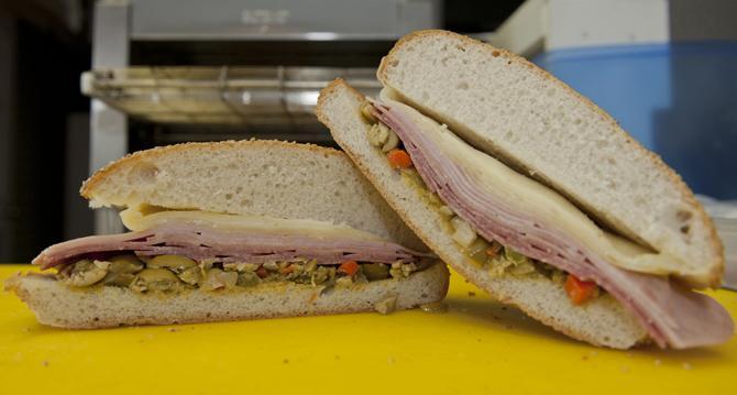 A whole muffaletta is completed Saturday, Jan. 26, 2013 at 926-Muff on Congress Blvd. The whole muffaletta will cost a customer $15 dollars. The 926-Muff is open 7 days a week from 11am-7pm and delivers to LSU.
 