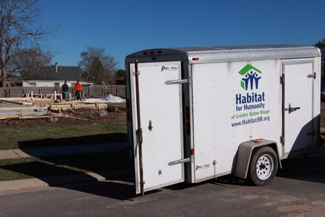 Volunteers prepare a construction site Thursday, Jan. 31, 2013, in the Rosewood neighborhood off Burbank Drive. Volunteers will construct homes as part of Super Saturday of Service organized by New Orleans Habitat for Humanity.
 