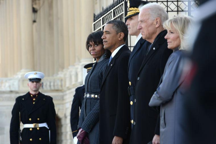 President Obama, first lady Michelle Obama, Vice President and Jill Biden, along with Maj. Gen. Michael S. Linnington, participate in the review of the troops on Capitol Hill in Washington, Tuesday, Jan. 21, 2013, following the president's ceremonial swearing-in ceremony during the 57th Presidential Inauguration. (AP Photo/Washington Post, Linda Davidson, Pool)
 