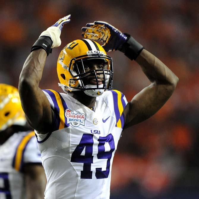 LSU junior defensive end Barkevious Mingo (49) motions to the LSU fans Monday, Dec. 31, 2012 during the Tigers' 24-25 loss in the Chick-fil-A Bowl against Clemson in Atlanta, Ga.
 