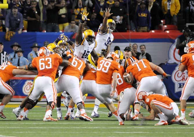 Clemson junior kicker Chandler Catanzaro (39) kicks the game-winning field goal Dec. 31, 2012 while LSU defenders stretch to block. LSU would lose 24-25.
 