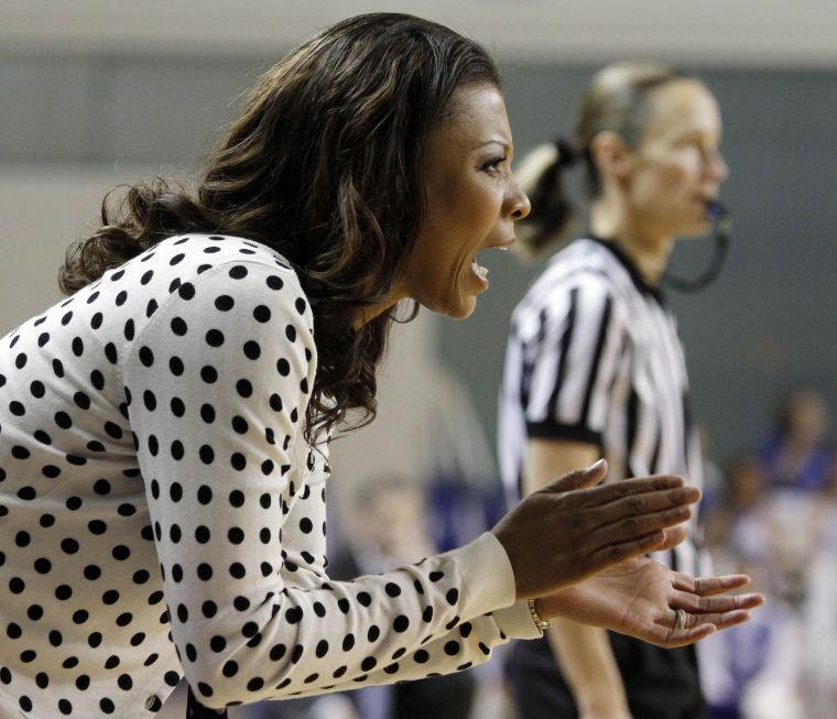 LSU head coach Nikki Caldwell encourages her team during the first half of an NCAA college basketball game against Kentucky at Memorial Coliseum in Lexington, Ky., Sunday, Jan. 27, 2013. (AP Photo/James Crisp)
 