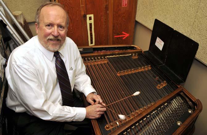 College of Music &amp; Dramatic Arts Dean Laurence Kaptain poses with his cimbalom Tuesday Jan. 29, 2013 in his practice space in the Music and Dramatic Arts building.
 