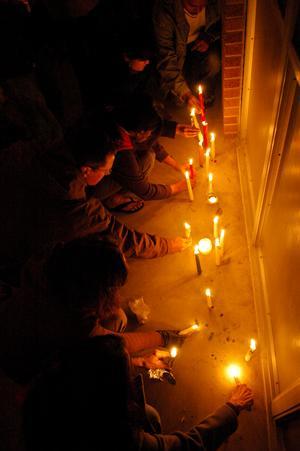 In this 2008 file photo, Students, friends, teachers and collegues of Ph.D. students Chandrasekhar Reddy Komma and Kiran Kumar Allam participate in a candlelight vigil.
 