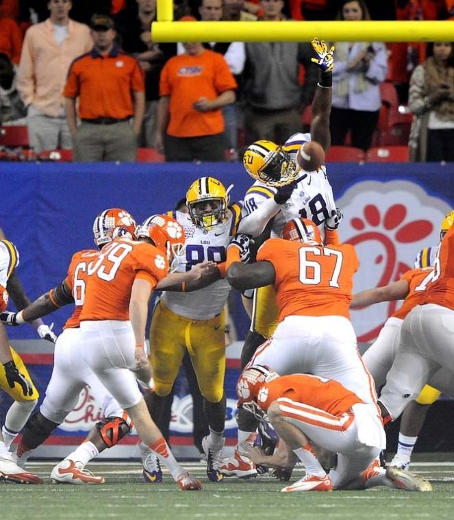 LSU junior defensive tackle Bennie Logan (18) reaches to block an extra point Monday, Dec. 31, 2012 during the Tigers' 24-25 loss in the Chick-fil-A Bowl against Clemson in Atlanta, Ga.
 