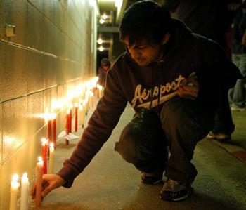 In this 2008 file photo, Students, friends, teachers and collegues of Ph.D. students Chandrasekhar Reddy Komma and Kiran Kumar Allam participate in a candlelight vigil.
 