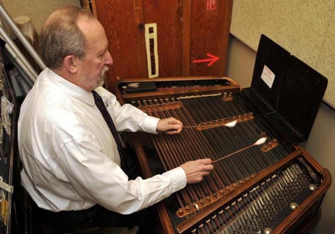 College of Music &amp; Dramatic Arts Dean Laurence Kaptain plays his cimbalom Tuesday Jan. 29, 2013 in his practice space in the Music and Dramatic Arts building.
 