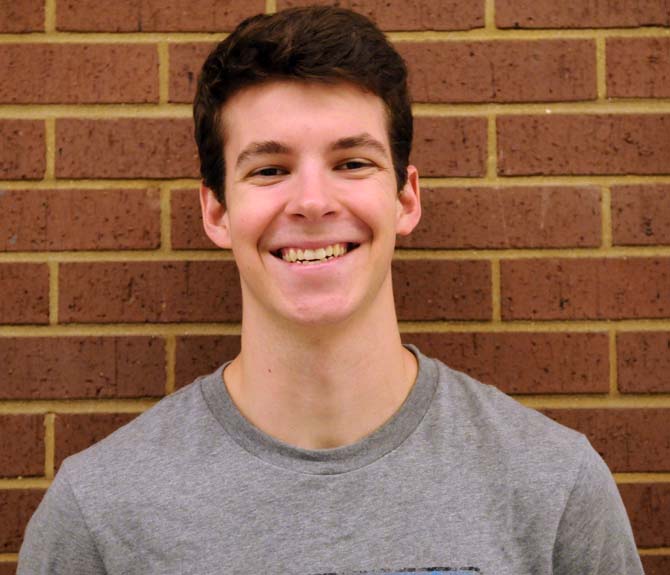 Accounting sophomore Garrett Arceneaux smiles for the camera post-workout. He has the New Year's resolution to meet the Navy Seal's fitness requirements just to see if he can do it.
 