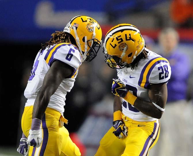 LSU junior safety Craig Loston (6) and freshman cornerback Jalen Mills (28) celebrate Monday, Dec. 31, 2012 during the Tigers' 24-25 loss in the Chick-fil-A Bowl against Clemson in Atlanta, Ga.
 