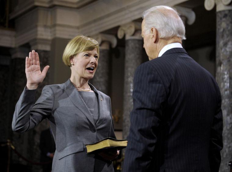 Vice President Joe Biden administers the Senate Oath to Sen. Tammy Baldwin, D-Wis. during a mock swearing in ceremony on Capitol Hill in Washington, Thursday, Jan. 3, 2013, as the 113th Congress officially began.(AP Photo/Cliff Owen)
 