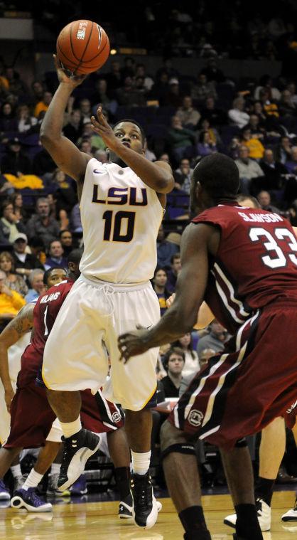 LSU junior guard Andre Stringer (10) shoots Wednesday, Jan. 16, 2012 over University of South Carolina's junior forward RJ Slawson (33) in the Tigers' 73-82 overtime loss to the Gamecocks in the PMAC.
 