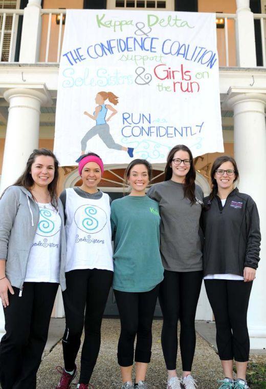 Sole Sisters running participants stand underneath a hand-painted sign Thursday January 17, 2013 in front of the Kappa Delta house near the LSU lakes. (From left to right) Elementary education junior Emily Labbe, mass communication junior Carley Wahlborg, kinesiology sophomore Caitlyn Babco, mass communication junior Amelia Brown, and accounting junior Molly Longo.
 