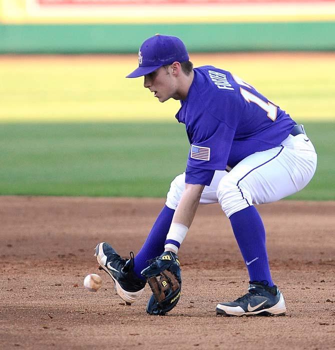 LSU sophomore infielder Jared Foster (17) scoops up a ground ball Jan. 25, 2013 during the Tigerls first preseason practice in Alex Box Stadium.
 