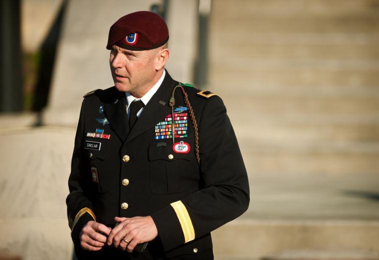 Army Brig. Gen. Jeffrey A. Sinclair leaves a Fort Bragg, N.C., courthouse Tuesday, Jan. 22, 2013, after he deferred entering a plea at his arraignment on charges of fraud, forcible sodomy, coercion and inappropriate relationships. Sinclair, who served five combat tours, is headed to trial following a spate of highly publicized military sex scandals involving high-ranking officers that has triggered a review of ethics training across the service branches. (AP Photo/The Fayetteville Observer, Andrew Craft)
 