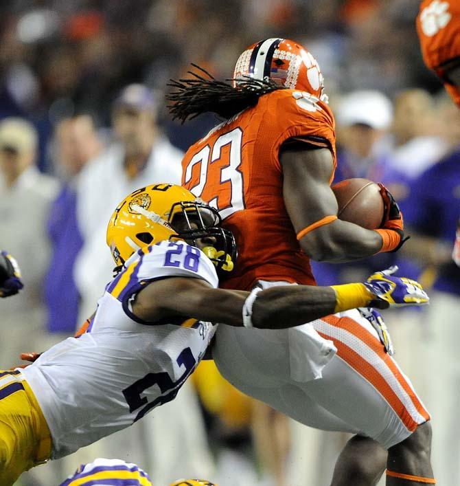 LSU freshman cornerback Jalen Milles (28) tackles Clemson running back Andre Ellington Monday, Dec. 31, 2012 during the Tigers' 24-25 loss in the Chick-fil-A Bowl against Clemson in Atlanta, Ga.
 