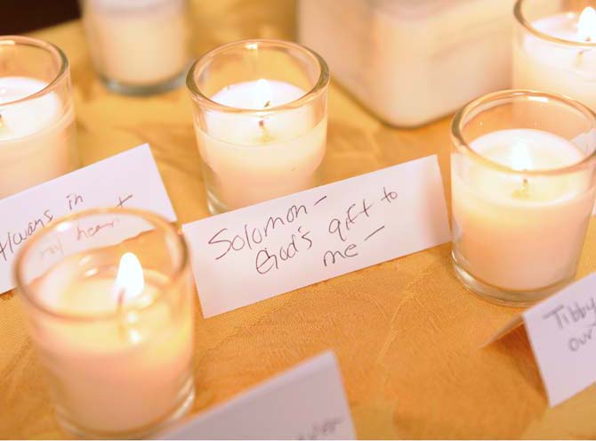 Families who have lost their pets to cancer lit candles on Jan. 12, 2013, at the LSU School of Veterinary Medicine.This year marks the 10th anniversary of the cancer treatment unit.
 