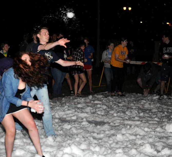 Students throw snow balls at each other Monday, Jan. 28, 2013, on the parade grounds. This is the first time in 3 years that LSU has hosted Snowing in the South.
 