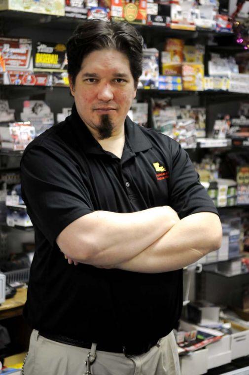 Shop manager James Gaspard stands inside of Louisiana's Double Play, Baton Rouge's only comic book store, Tuesday, Jan. 19, 2013. The shop is located on S. Sherwood Forest Blvd.
 