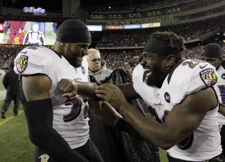 Baltimore Ravens inside linebacker Ray Lewis (52) and free safety Ed Reed (20) celebrate after their win against the New England Patriots in the NFL football AFC Championship football game in Foxborough, Mass., Sunday, Jan. 20, 2013. The Ravens won 28-13 to advance to Super Bowl XLVII. (AP Photo/Matt Slocum)
 