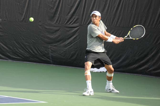 LSU senior Stefan Szacinski winds up to return the ball during the Tigers' tennis match against Southern Miss Monday Jan. 21, 2013 in W.T. "Dub" Robinson Stadium.
 