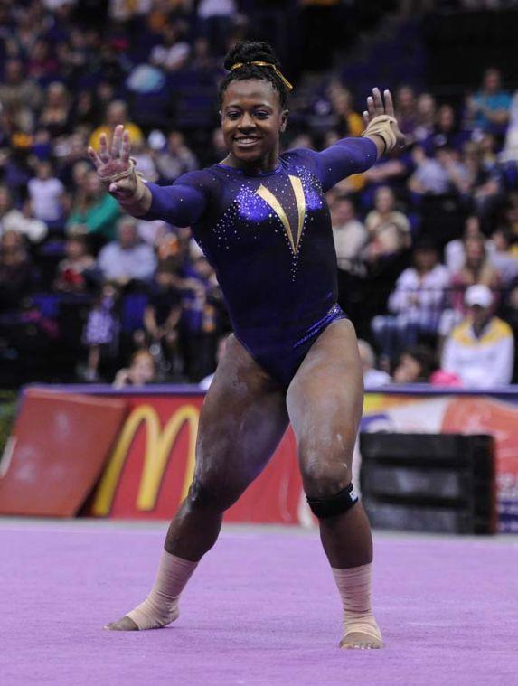 LSU sophomore all-around Lloimincia Hall smiles in her floor routine Jan. 11, 2013 during the Tiger's 196.875-196.575 upset of the Florida Gators in the PMAC. Hall's routine scored a 9.95, securing victory.
 